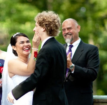 wedding couple with officiant