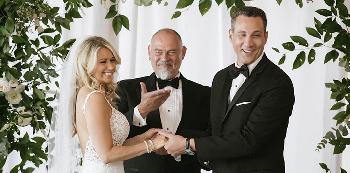 Bride,  Groom,and NYC Wedding Officiant smile at guests